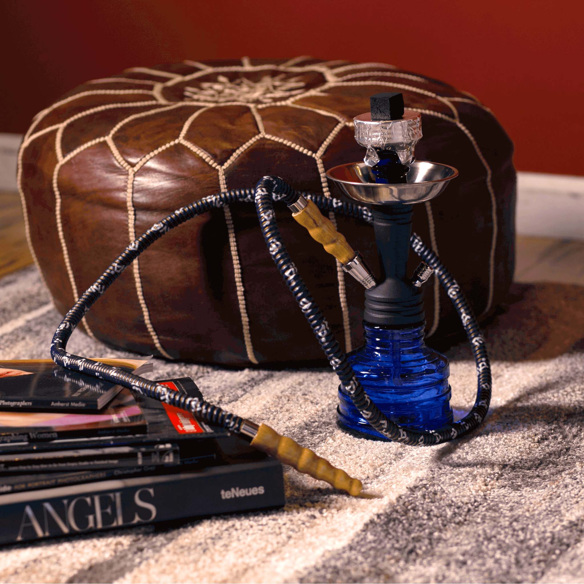 Sky blue PIA Hookah sitting on an attractive rug