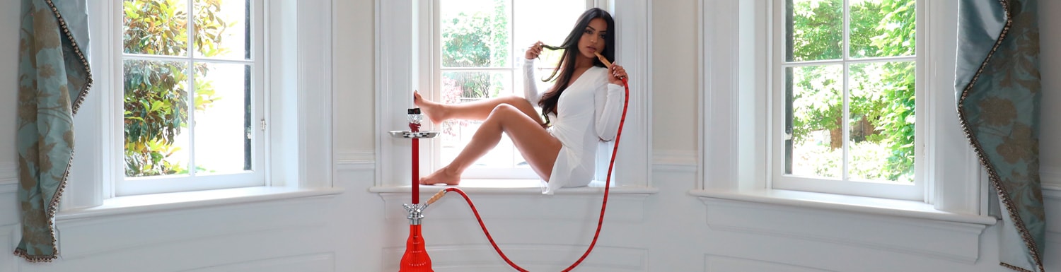 MYA banner with model smoking hookah in window sill
